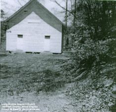 Early photo of the church - the cemetery is located up the hill to the right